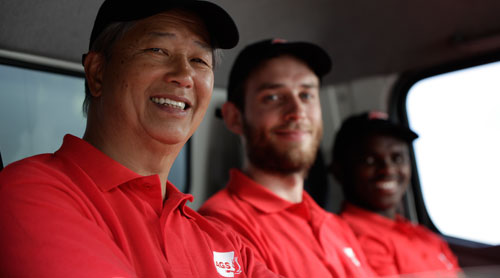 AGS Movers staff photographed in a moving truck.